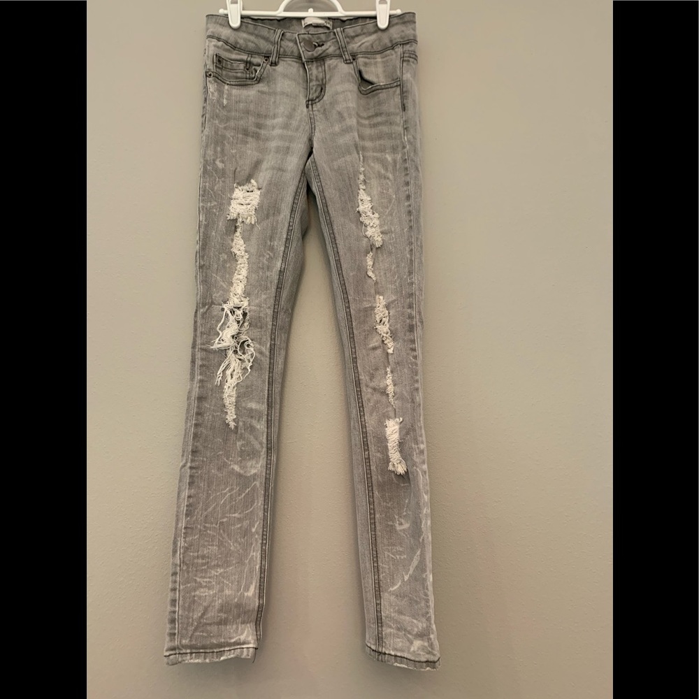 Edgy faded black ripped jeans